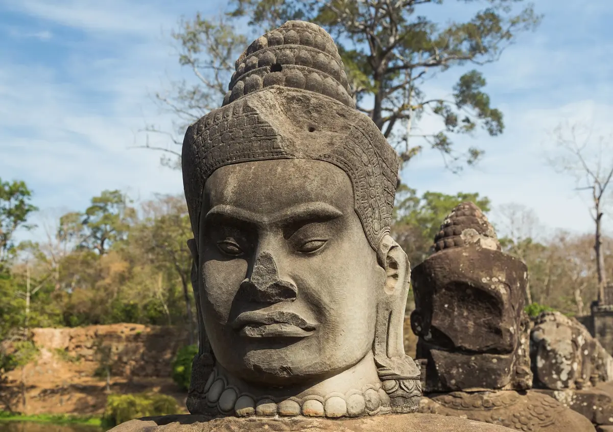 A stone guardian head at the south gate