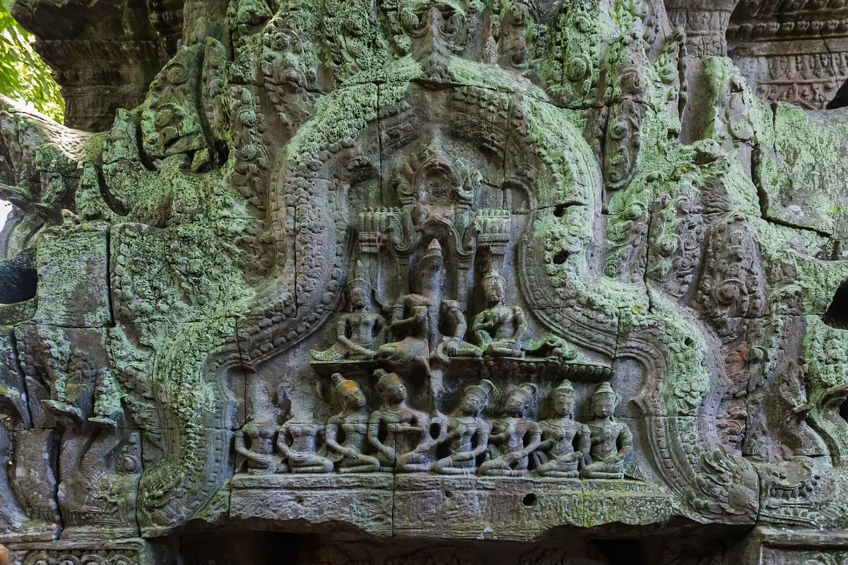 Tree roots growing over the walls of Ta Prohm